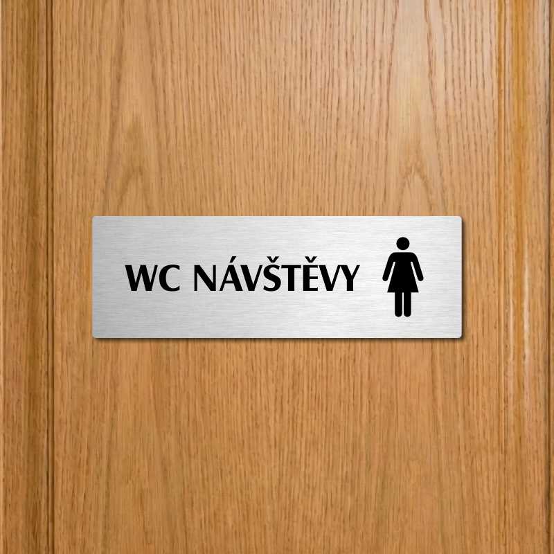 WC návštěvy ženy, 240x79mm, stříbrná popiska 